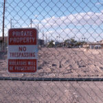 Empty lot with "no trespassing" sign