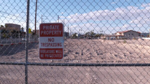Empty lot with "no trespassing" sign