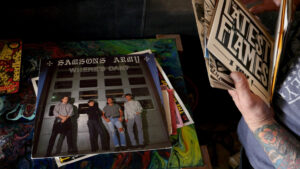 A person flips through 7-inch records